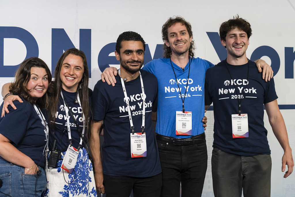 Speaker discussing production Kubernetes at KCD NY 2025